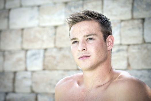 Portrait of a young, handsome and shirtless man
