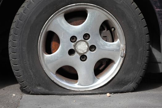 Flat tire of an old car