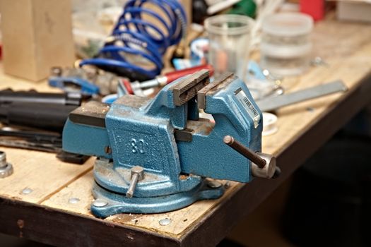 Old vise on a workshop table