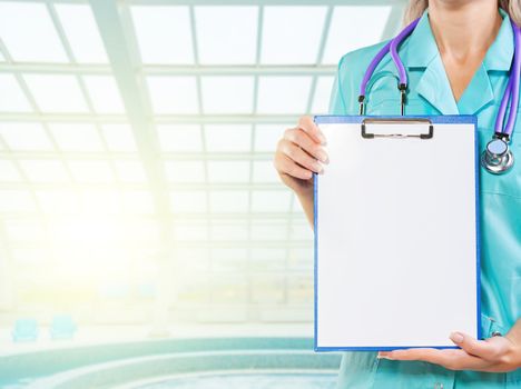 clipboard in hands of female doctor