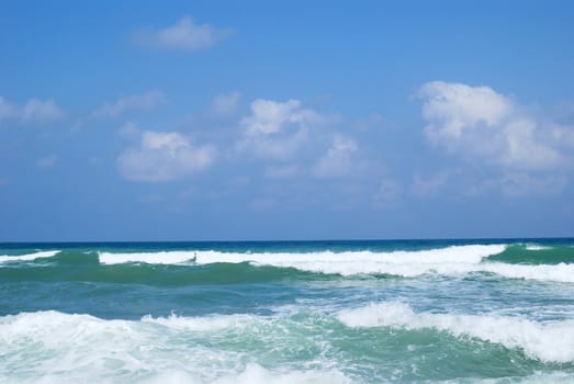 Running waves under the blue sky. Mediterranean sea.