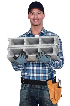 Mason carrying breeze block