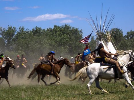 Indian warriors on fast horses in reenactment of Battle of Bighorn