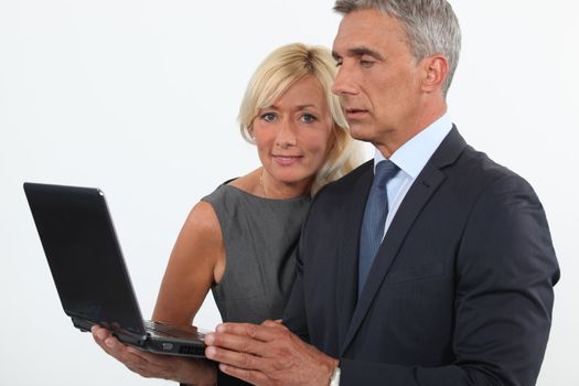 Man and woman with computer