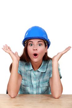 Surprised female construction worker