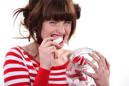 Female eating marshmallows