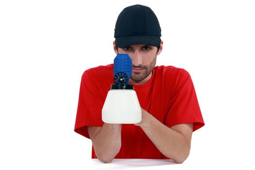 Tradesman holding a spray gun