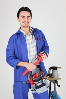 Man stood with wrench and blow torch