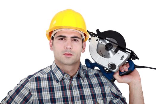 Man posing with electrical saw