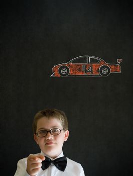 Education needs you thinking boy dressed up as business man with Nascar racing fan car on blackboard background