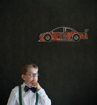 Thinking boy dressed up as business man with Nascar racing fan car on blackboard background