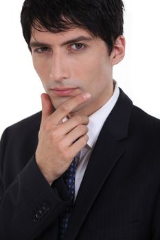 Businessman with his hand on his chin