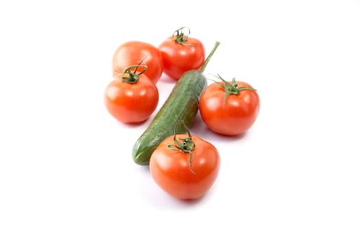 Cucumber and tomatoes on a white background