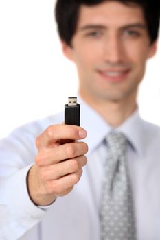 Businessman holding a usb key