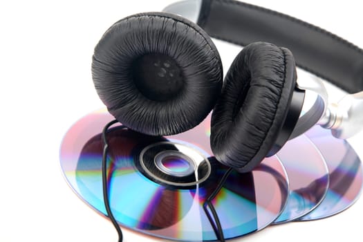 headphone and compact discs on a white background