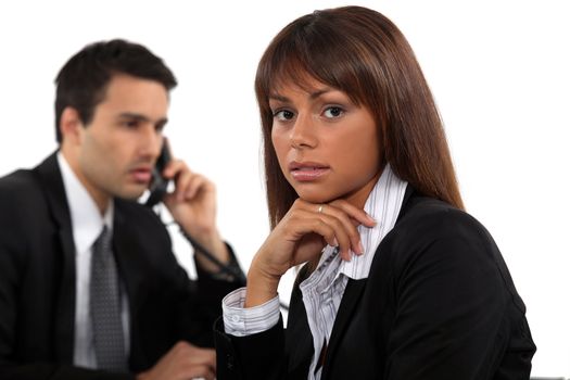 Two young businesspeople working together