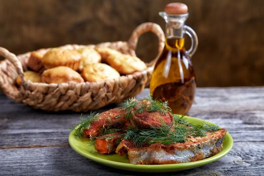 Still-life with fried fish and bread