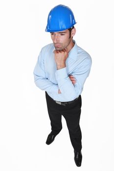 businessman wearing helmet and thinking