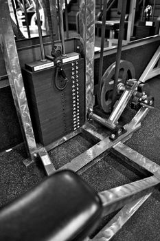 Black and white image of the weight or resistance selector on professional exercise equipment at a commercial gym