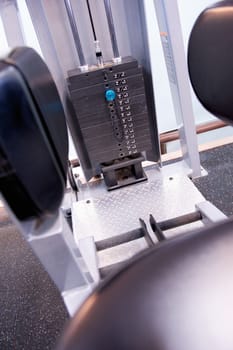 Black and white image of the weight or resistance selector on professional exercise equipment at a commercial gym