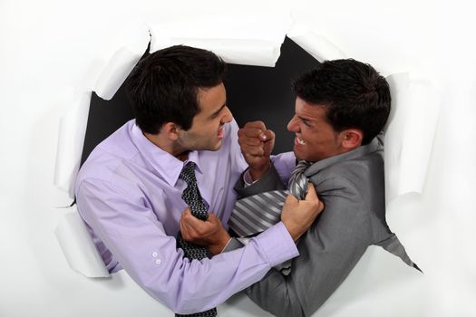 Two businessmen fighting
