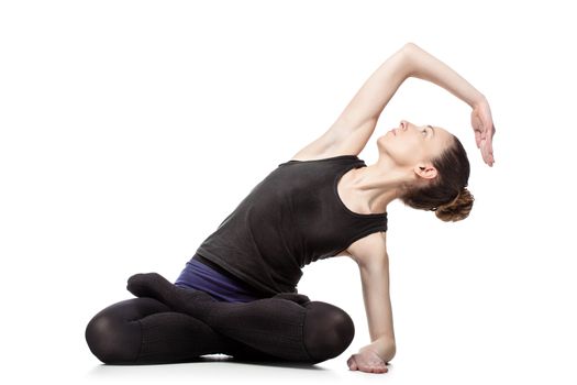 caucasian woman exercising pilates poses, isolated in studio