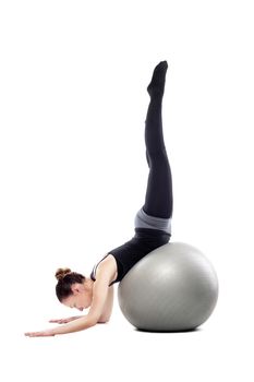 caucasian woman exercising pilates poses, isolated in studio