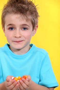 little boy receiving candies