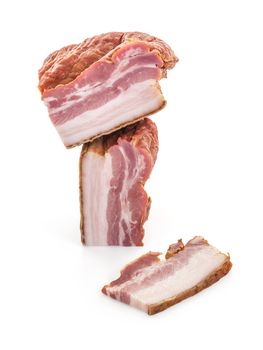 Three Big Cuts of Smoked Bacon over White Background, shallow focus, vertical shot