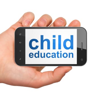 Education concept: hand holding smartphone with word Child Education on display. Generic mobile smart phone in hand on White background.