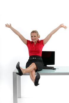 Relaxed woman sitting on her desk