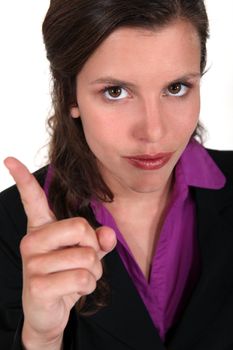 young businesswoman with her finger up