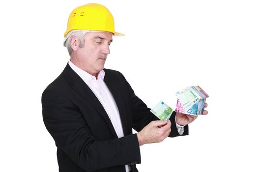 portrait of foreman holding money box