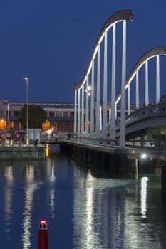 The Moll d'Espanya (Moll meaning quay) leading across to the Maritime complex and the waterfront of Port Vell (Placa del Portal de la Pau) in the Old Town district of Barcelona in the Catalonia region of Spain.