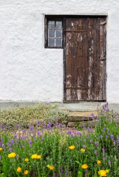 Entrance to a rural house, with garden in front of it. Gotland, Sweden.