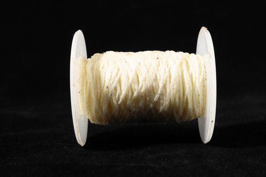 Roll of Twine isolated on a Black Background