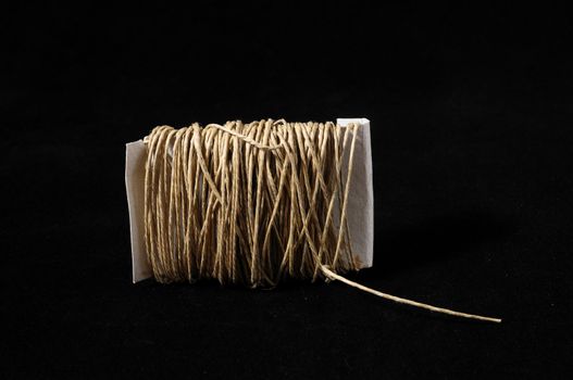 Roll of Twine isolated on a Black Background