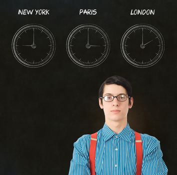 Nerd geek businessman with chalk time difference clocks on blackboard background