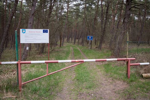 Krynica Morska, Poland - May 2, 2013: Forest gate at the Polish-Russian frontier near the Baltic Sea coast, which at this point is also the border between the European Union and the Russian Federation.