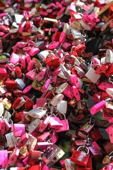 Verona, Italy – July 18, 2013: Padlocks as symbols of romantic love, hung by tourists at famous Juliet's House in Verona, Italy