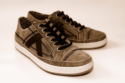 A pair of used comfortable shoes on a white background