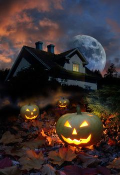 Halloween pumpkin lanterns in haunted house garden