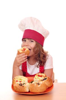 little girl cook eat bread filled with cheese and vegetables