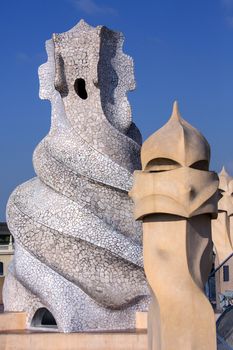 Ornate chimney designs on the roof of Gaudi's Casa Milia in the Eixample district of Barcelona in the Catalonia region of Spain.