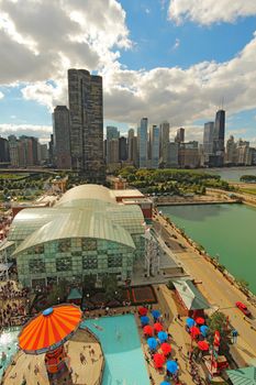 CHICAGO, ILLINOIS - SEPTEMBER 4: Aerial view of Navy Pier in Chicago, Illinois with a skyline background on September 4, 2011. The Pier is a popular destination with many attractions on Lake Michigan.