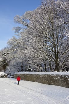 Winter snow in a village in North Yorkshire in the northeast of England in the United Kingdom (Model Released)