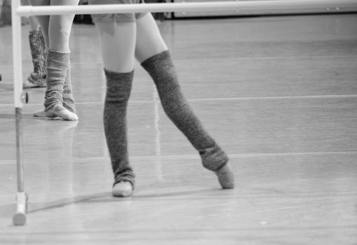 ballet dancers feet during practice in black and white
