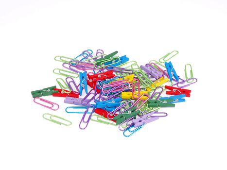 Paper clips and pegs on a white background.