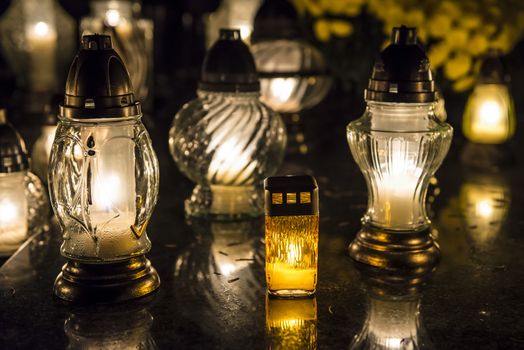 Candles on a grave at night