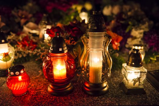 Candles on a grave at night